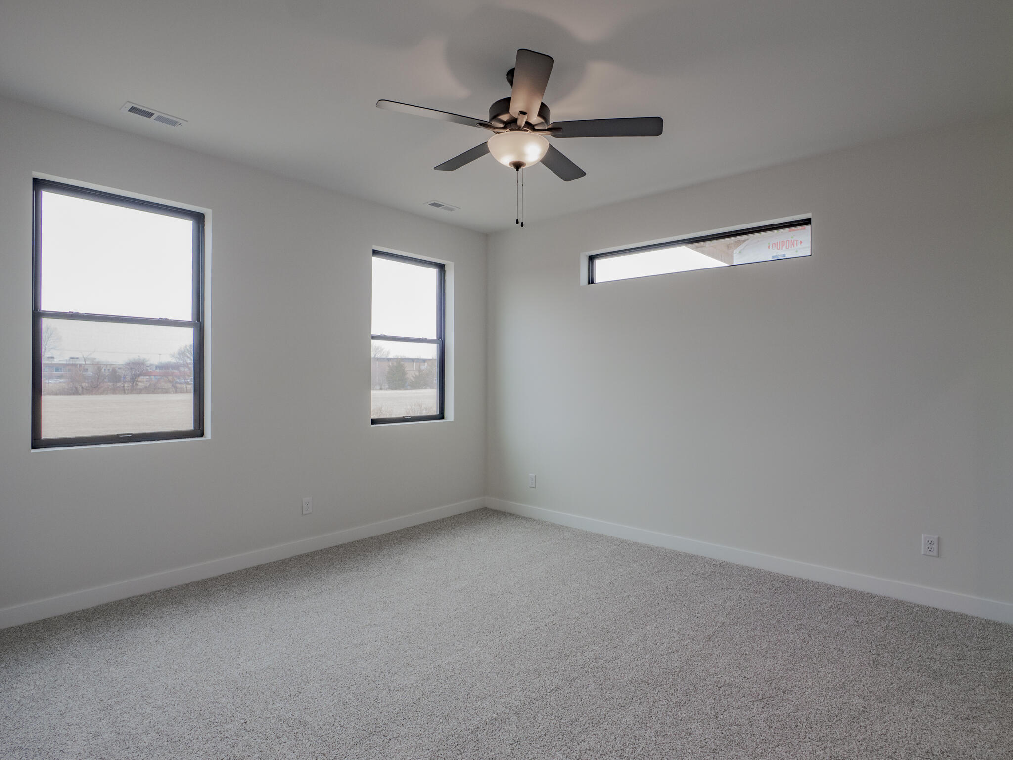244 Sawgrass Drive Crown Point, IN 46307 - Photo 15 of 19 an empty room with windows and fan