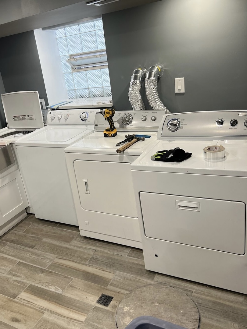 2122 North Keystone Avenue, Unit G Chicago, IL 60639 - Photo 4 of 4 a utility room with dryer and washer