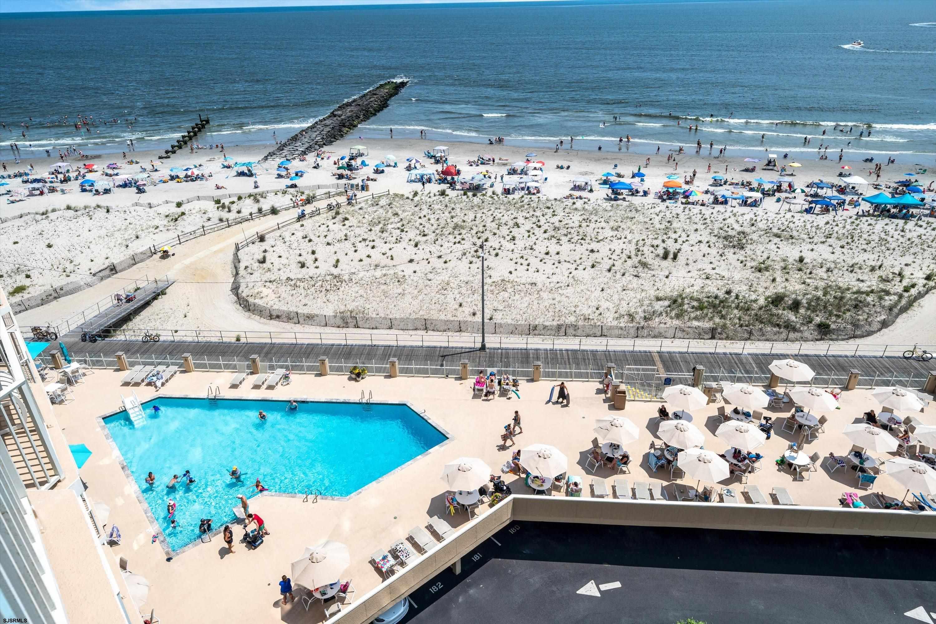 322 Boardwalk, Unit 1007 Ocean City, NJ 08226 - Photo 2 of 27 a view of a water fountain and many potted plants
