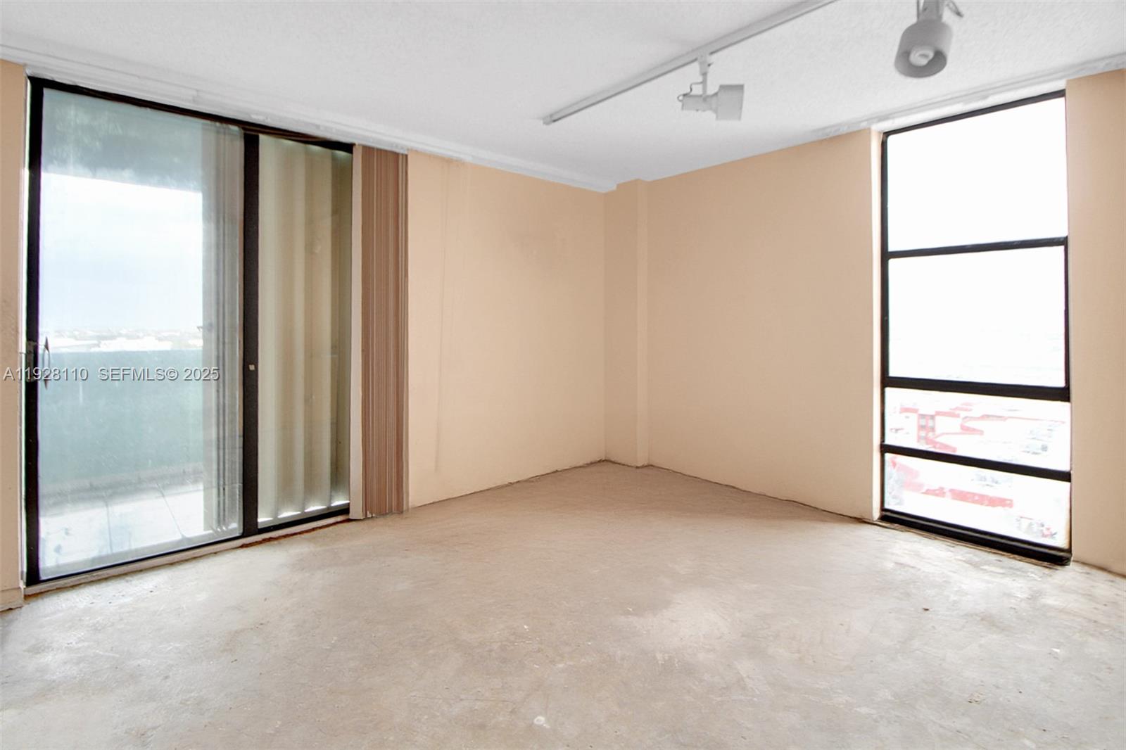 1825 West 44th Place, Unit 1111 Hialeah, FL 33012 - Photo 12 of 22 an empty room with windows