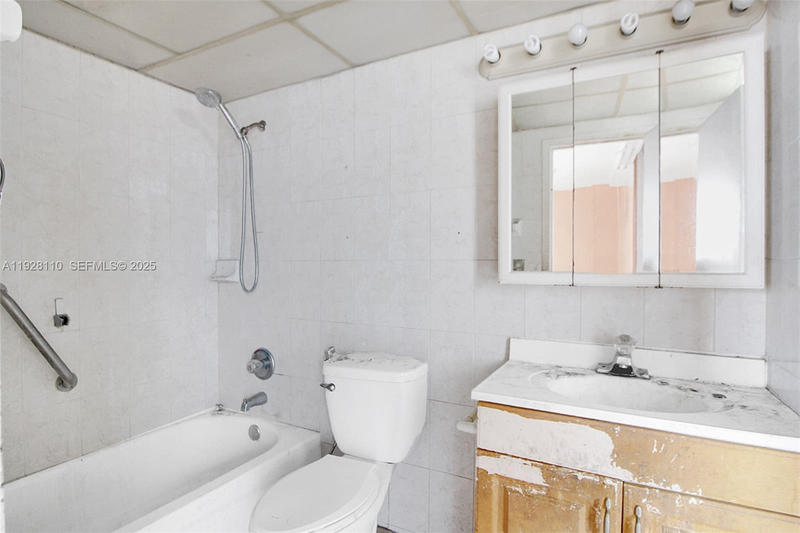 1825 West 44th Place, Unit 1111 Hialeah, FL 33012 - Photo 13 of 22 a bathroom with a sink toilet and shower