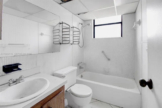 a bathroom with a sink a toilet and a bathtub