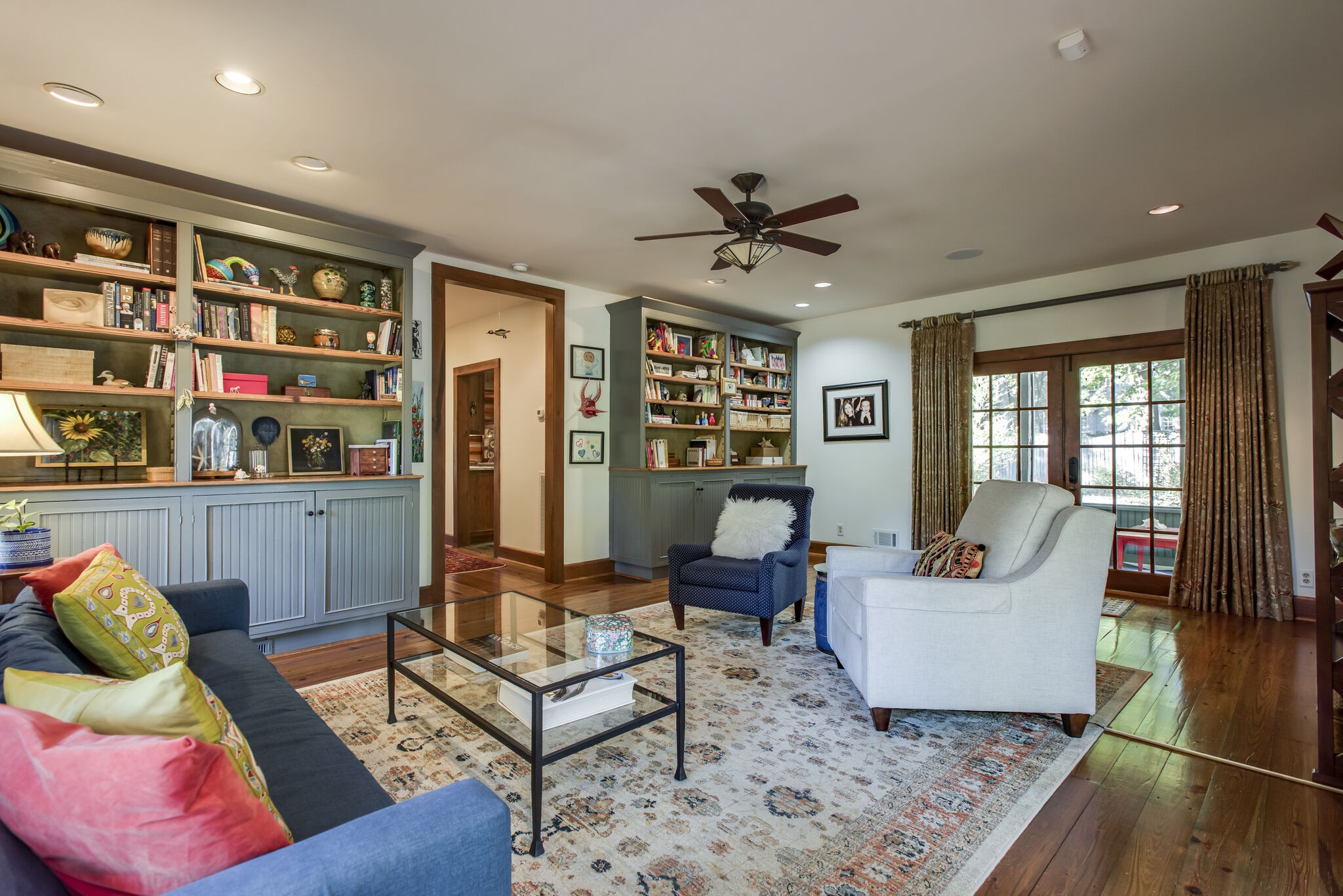 6230 Bresslyn Road Nashville, TN 37205 - Photo 24 of 53 a living room with furniture and a book shelf