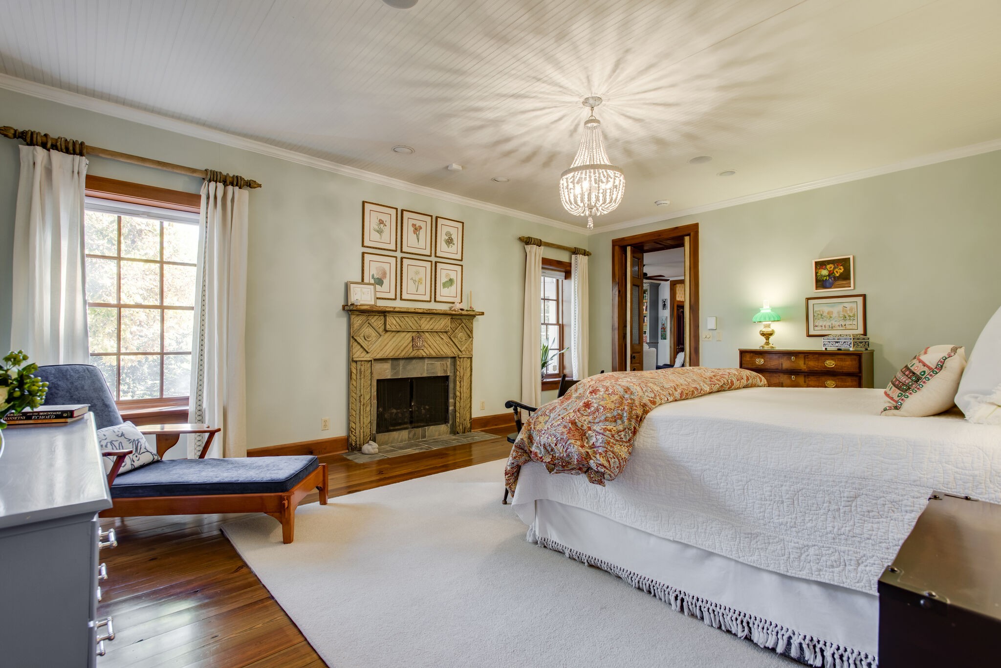 6230 Bresslyn Road Nashville, TN 37205 - Photo 30 of 53 a spacious bedroom with a bed and a chandelier