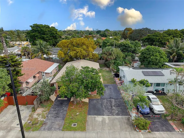 an aerial view of a house with a garden