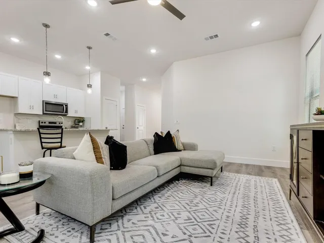 a living room with furniture and a rug
