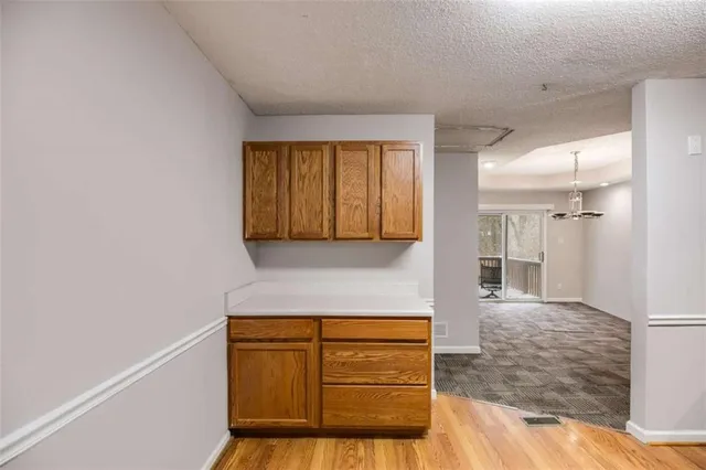 a view of an empty room with a closet