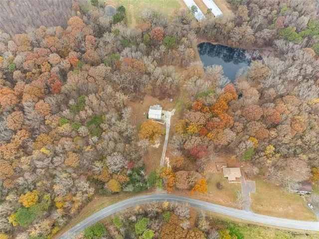 a view of a yard with snow on the road
