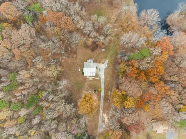 a view of a house with a yard and garage