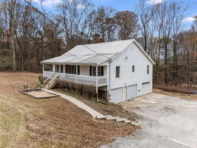 a view of a house with wooden fence