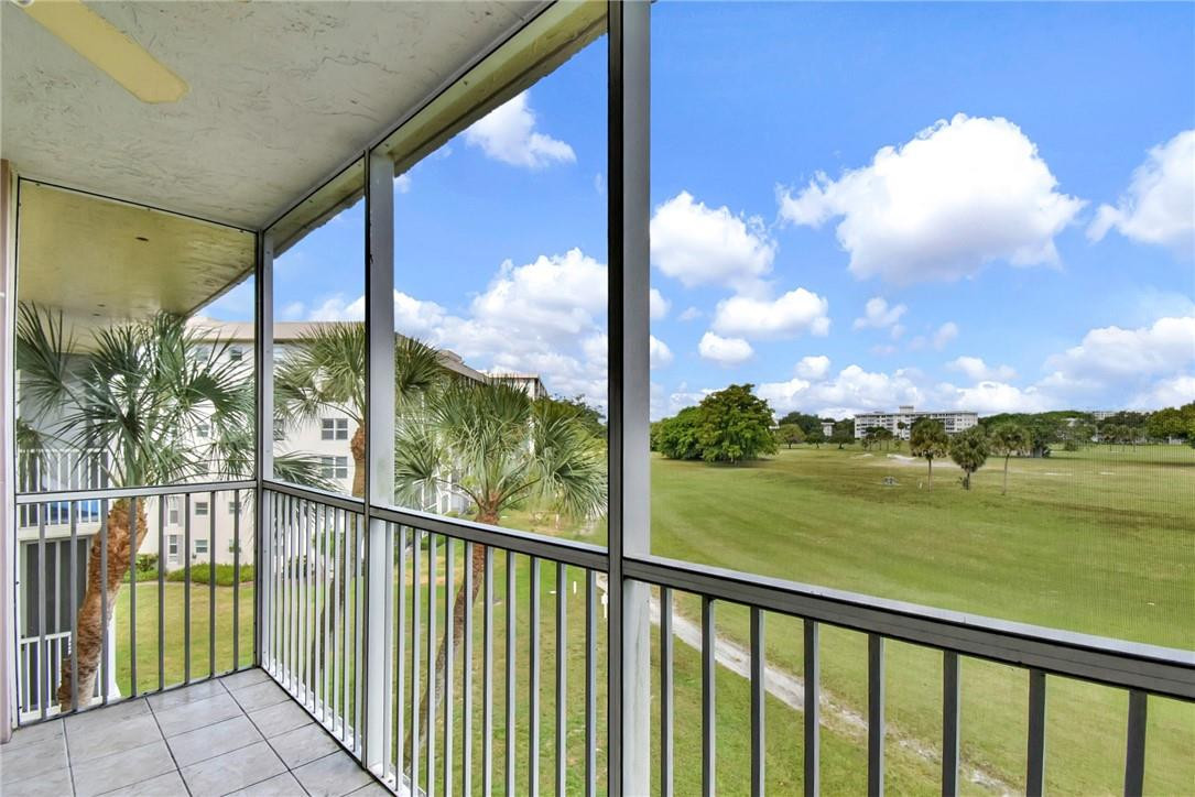 2601 South Course Drive, Unit 409 Pompano Beach, FL 33069 - Photo 24 of 58 a view of a city from a balcony