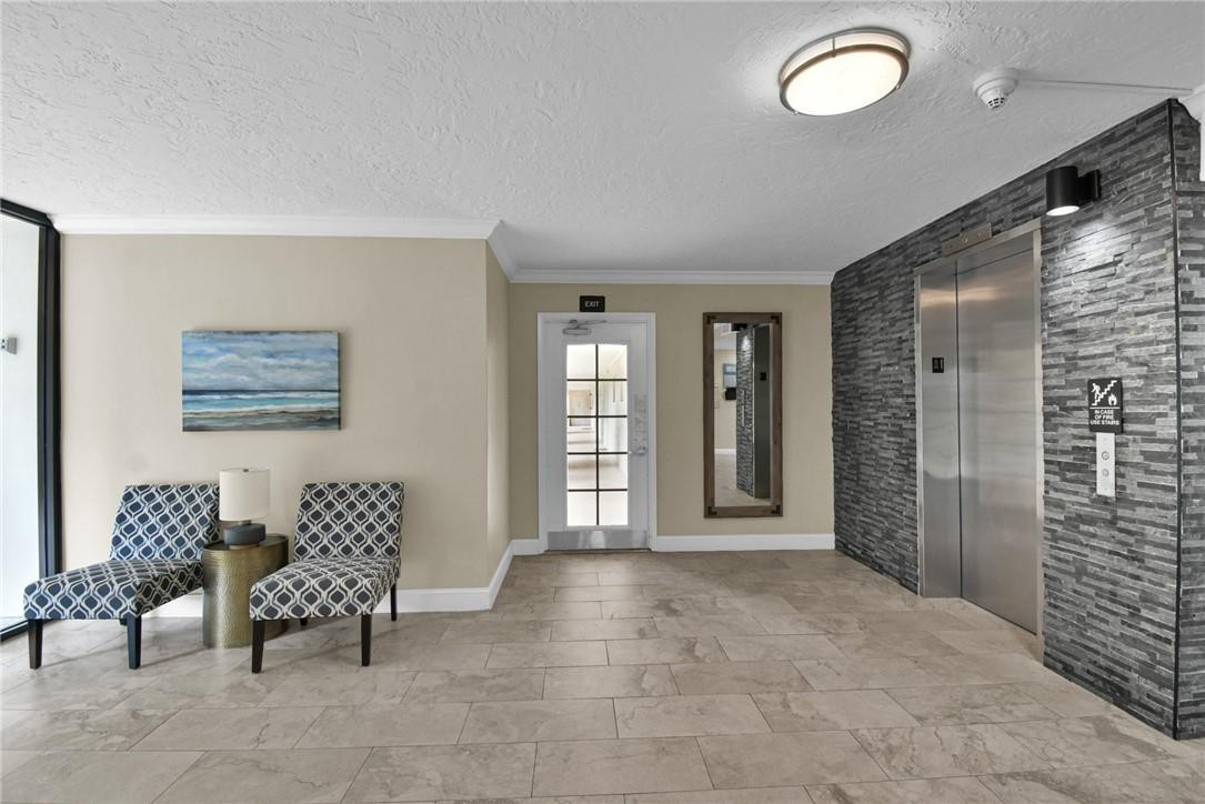 2601 South Course Drive, Unit 409 Pompano Beach, FL 33069 - Photo 32 of 58 a view of livingroom with furniture and windows