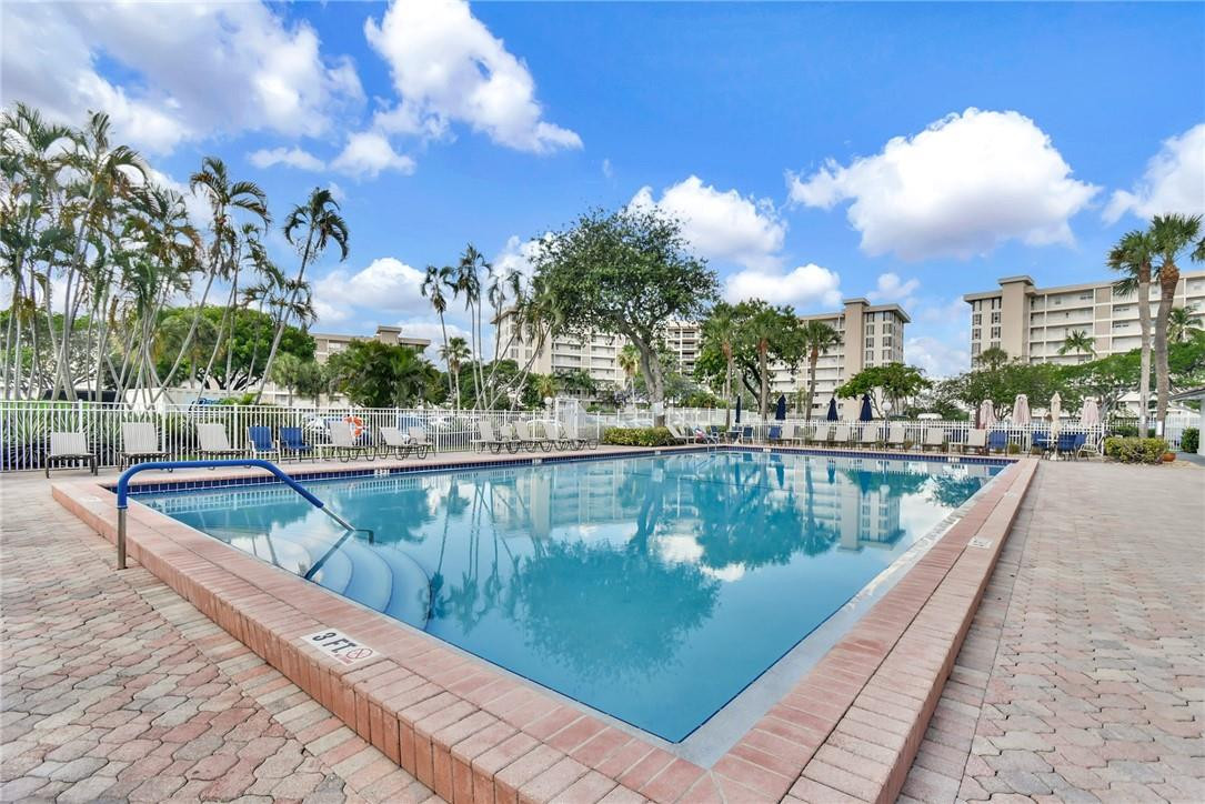 2601 South Course Drive, Unit 409 Pompano Beach, FL 33069 - Photo 34 of 58 a view of a lake with a city