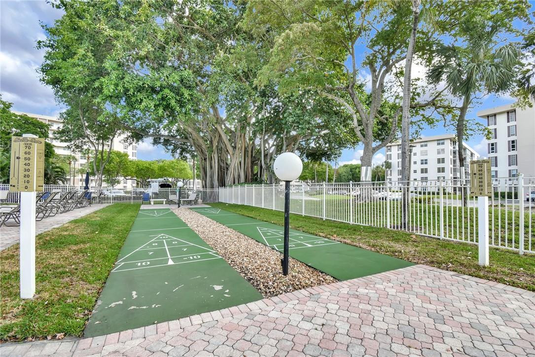 2601 South Course Drive, Unit 409 Pompano Beach, FL 33069 - Photo 39 of 58 a view of a park with large trees