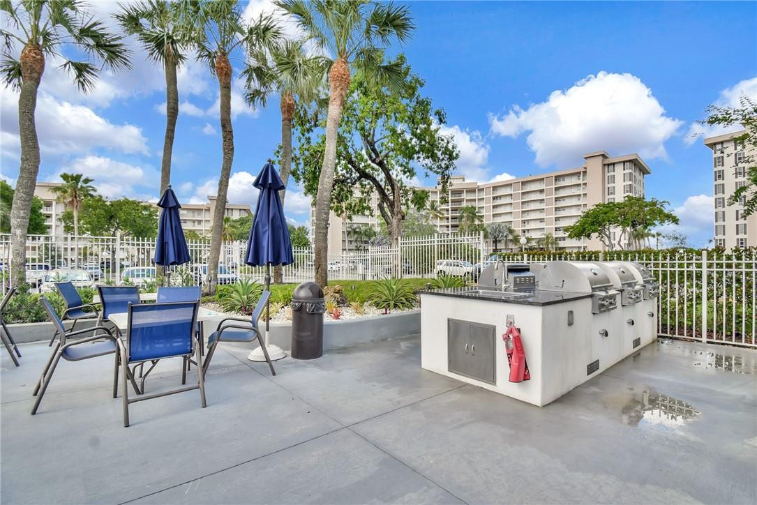 2601 South Course Drive, Unit 409 Pompano Beach, FL 33069 - Photo 46 of 58 Poolside Grill/BBQ area