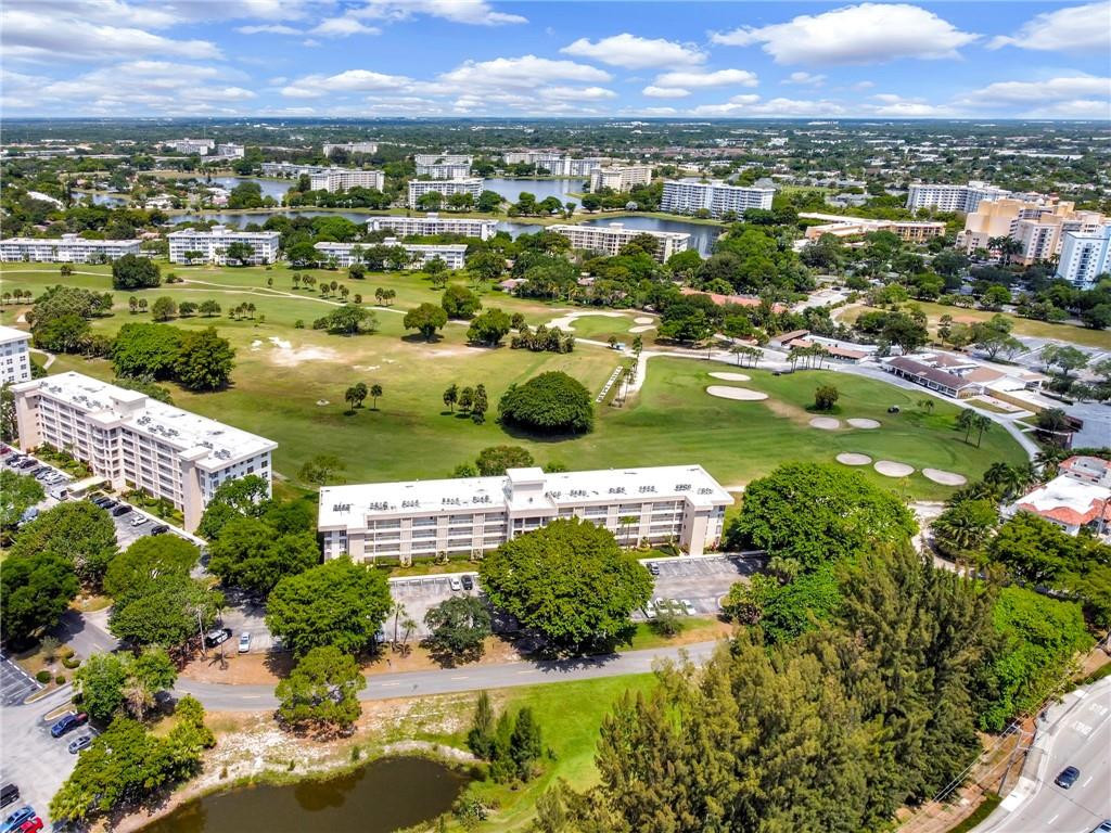 2601 South Course Drive, Unit 409 Pompano Beach, FL 33069 - Photo 49 of 58 an aerial view of residential houses with outdoor space