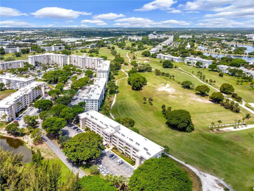 2601 South Course Drive, Unit 409 Pompano Beach, FL 33069 - Photo 51 of 58 an aerial view of residential houses with outdoor space