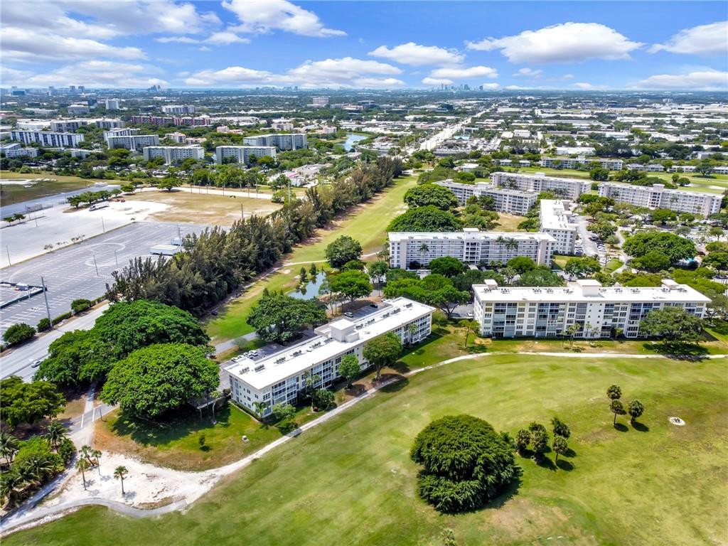 2601 South Course Drive, Unit 409 Pompano Beach, FL 33069 - Photo 54 of 58 an aerial view of residential houses with outdoor space