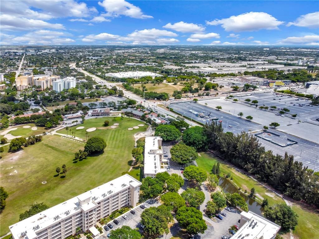 2601 South Course Drive, Unit 409 Pompano Beach, FL 33069 - Photo 58 of 58 an aerial view of residential houses with outdoor space