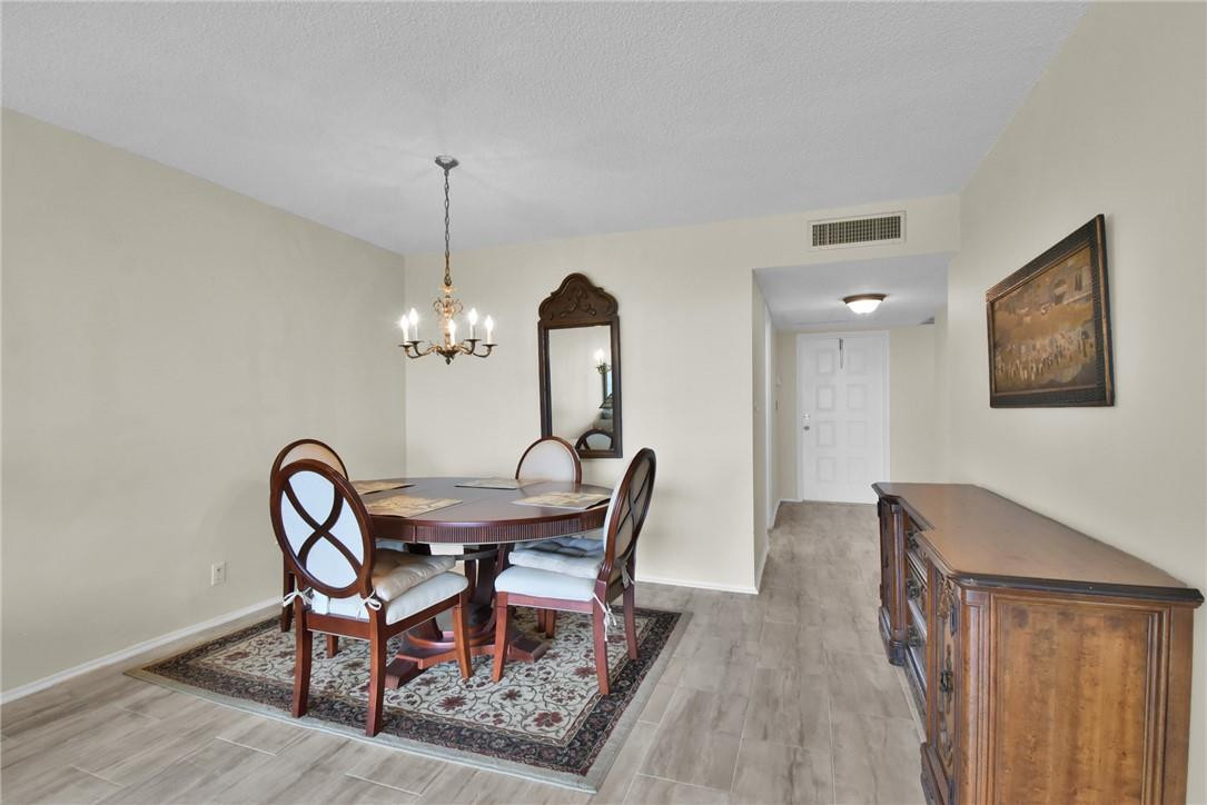 2601 South Course Drive, Unit 409 Pompano Beach, FL 33069 - Photo 6 of 58 a dining room with furniture and window