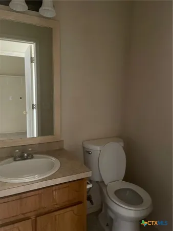 a bathroom with a toilet and a sink