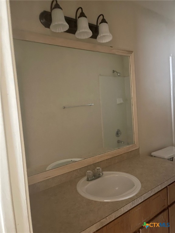 2712 Vernice Loop, Unit B Killeen, TX 76549 - Photo 20 of 30 a bathroom with a sink and a mirror