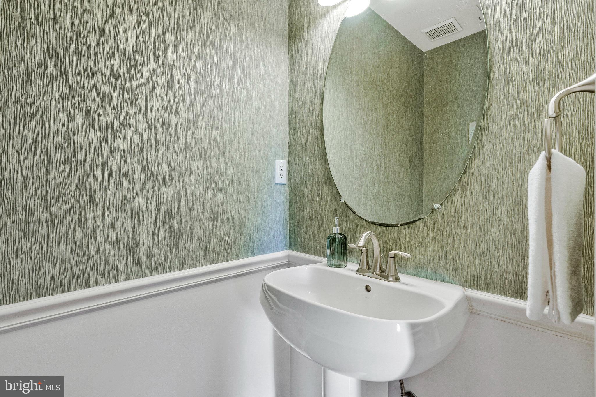 2043 Pieris Court Vienna, VA 22182 - Photo 13 of 43 a bathroom with a sink and a mirror
