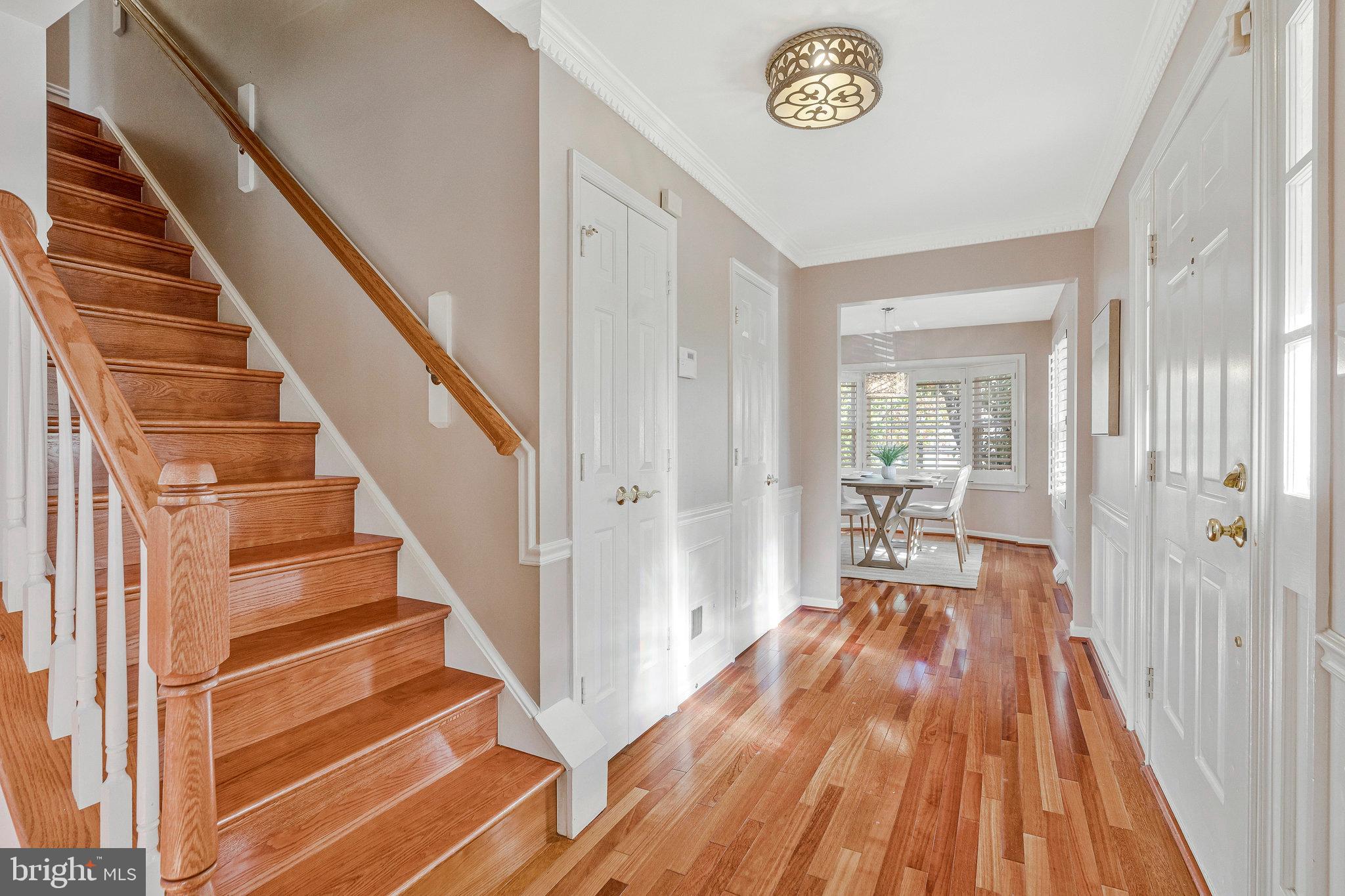 2043 Pieris Court Vienna, VA 22182 - Photo 14 of 43 a view of a hallway with wooden floor and entryway