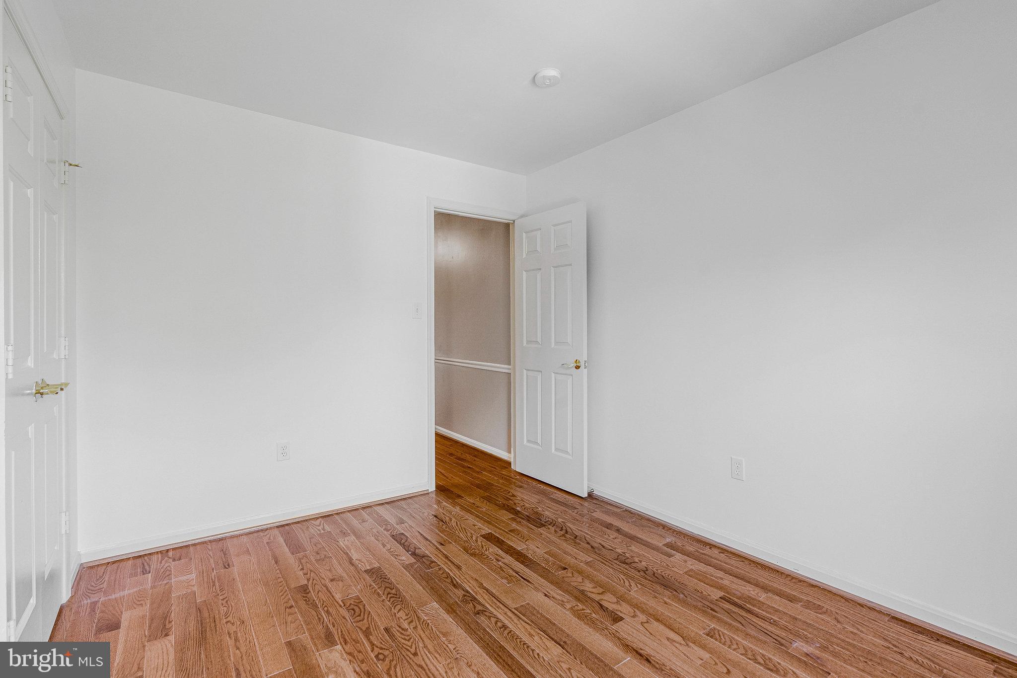 2043 Pieris Court Vienna, VA 22182 - Photo 21 of 43 a view of an empty room with wooden floor