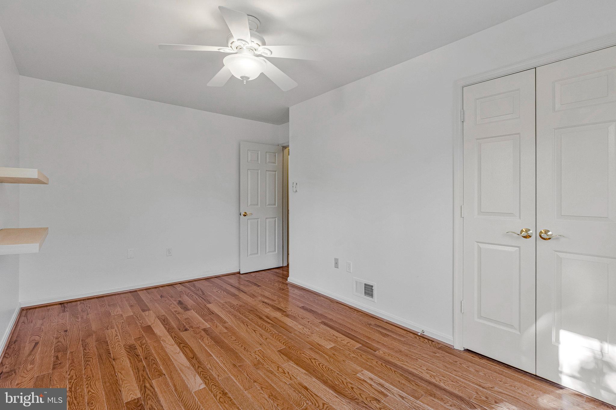 2043 Pieris Court Vienna, VA 22182 - Photo 23 of 43 wooden floor in an empty room