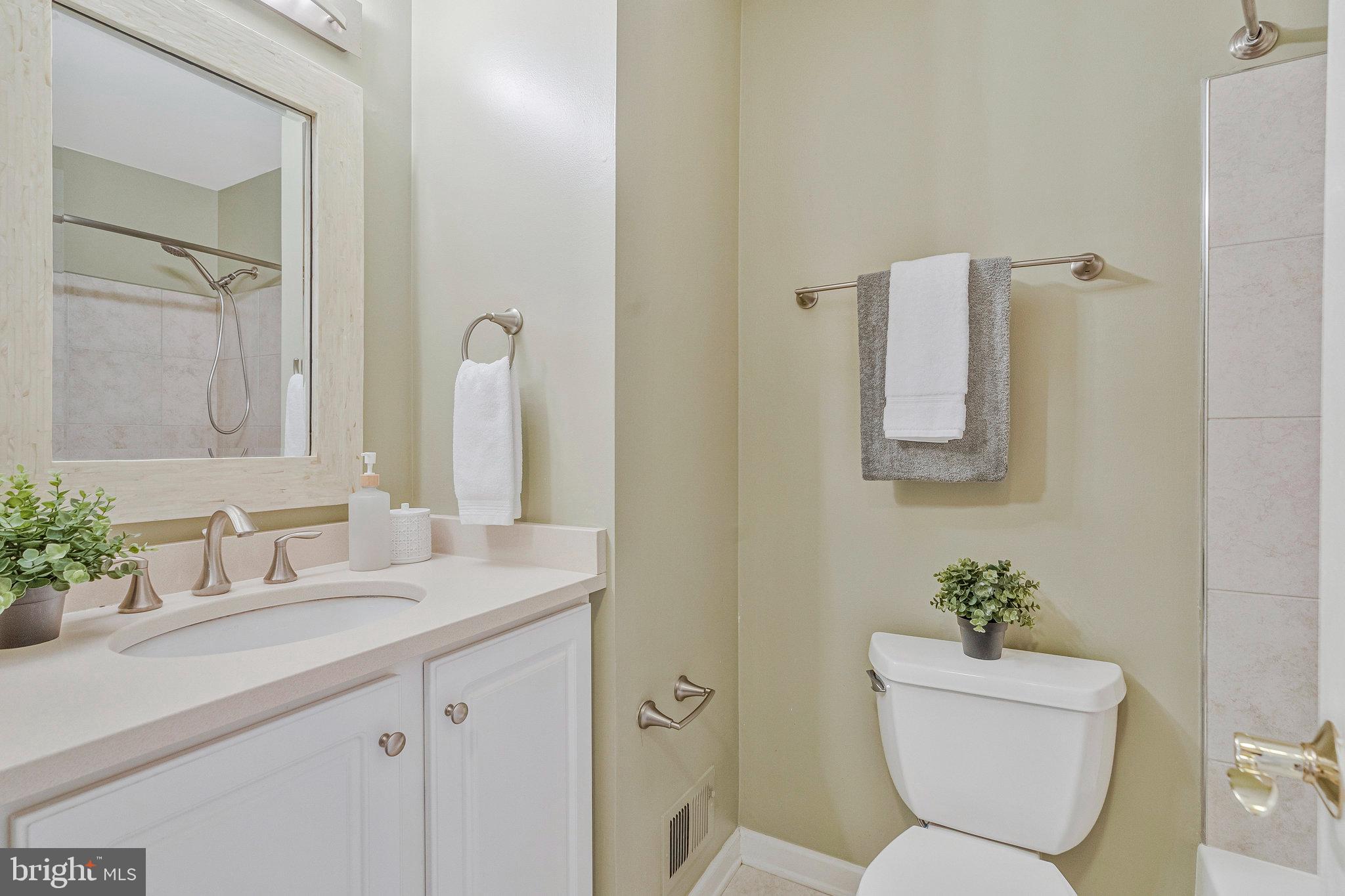 2043 Pieris Court Vienna, VA 22182 - Photo 24 of 43 a bathroom with a toilet sink and mirror