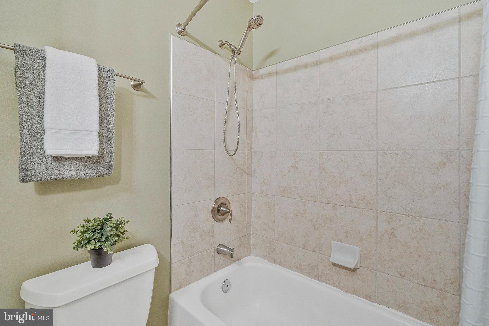 2043 Pieris Court Vienna, VA 22182 - Photo 25 of 43 a bathroom with a sink a toilet and shower