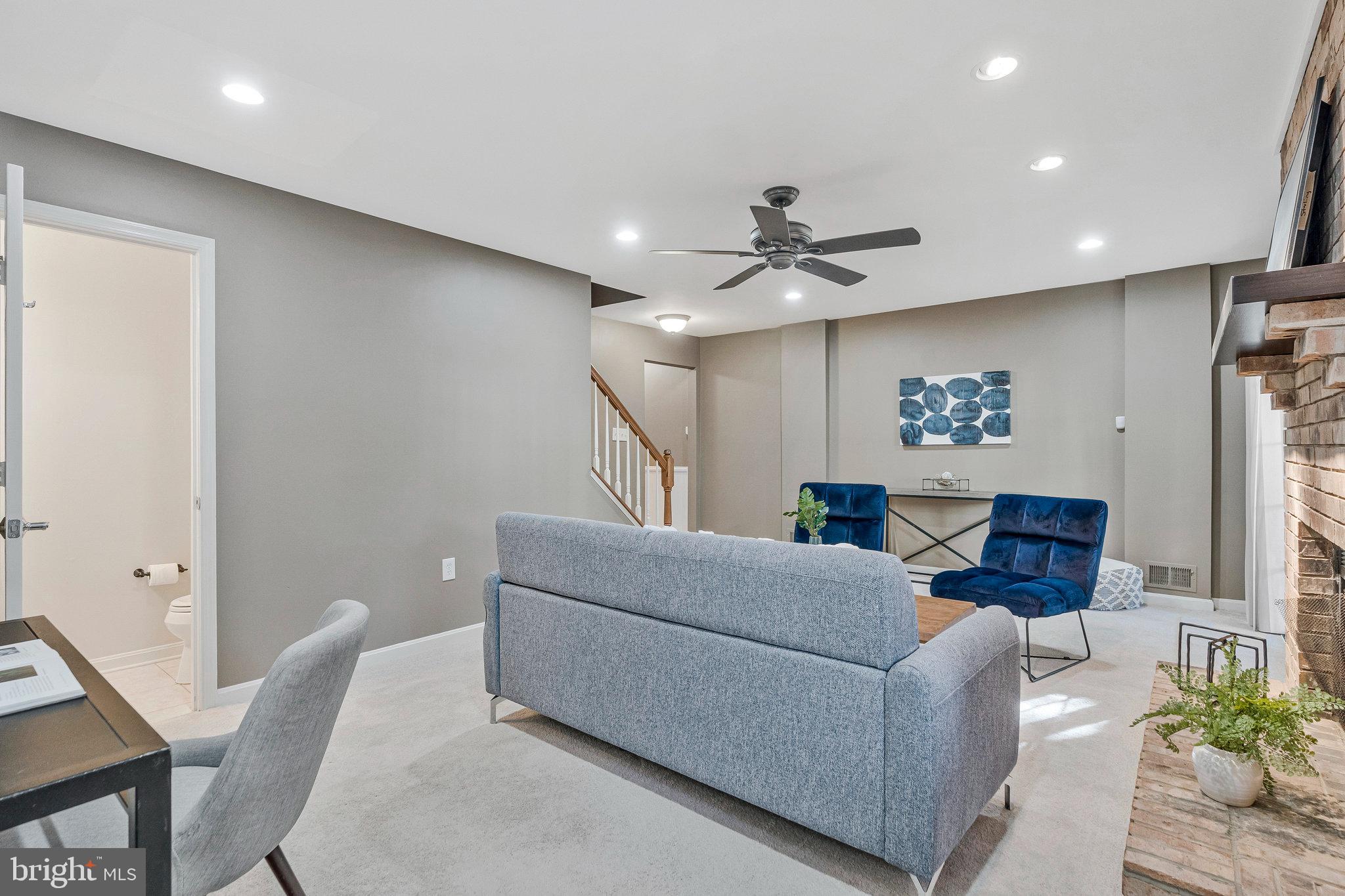 2043 Pieris Court Vienna, VA 22182 - Photo 27 of 43 a living room with furniture and a ceiling fan