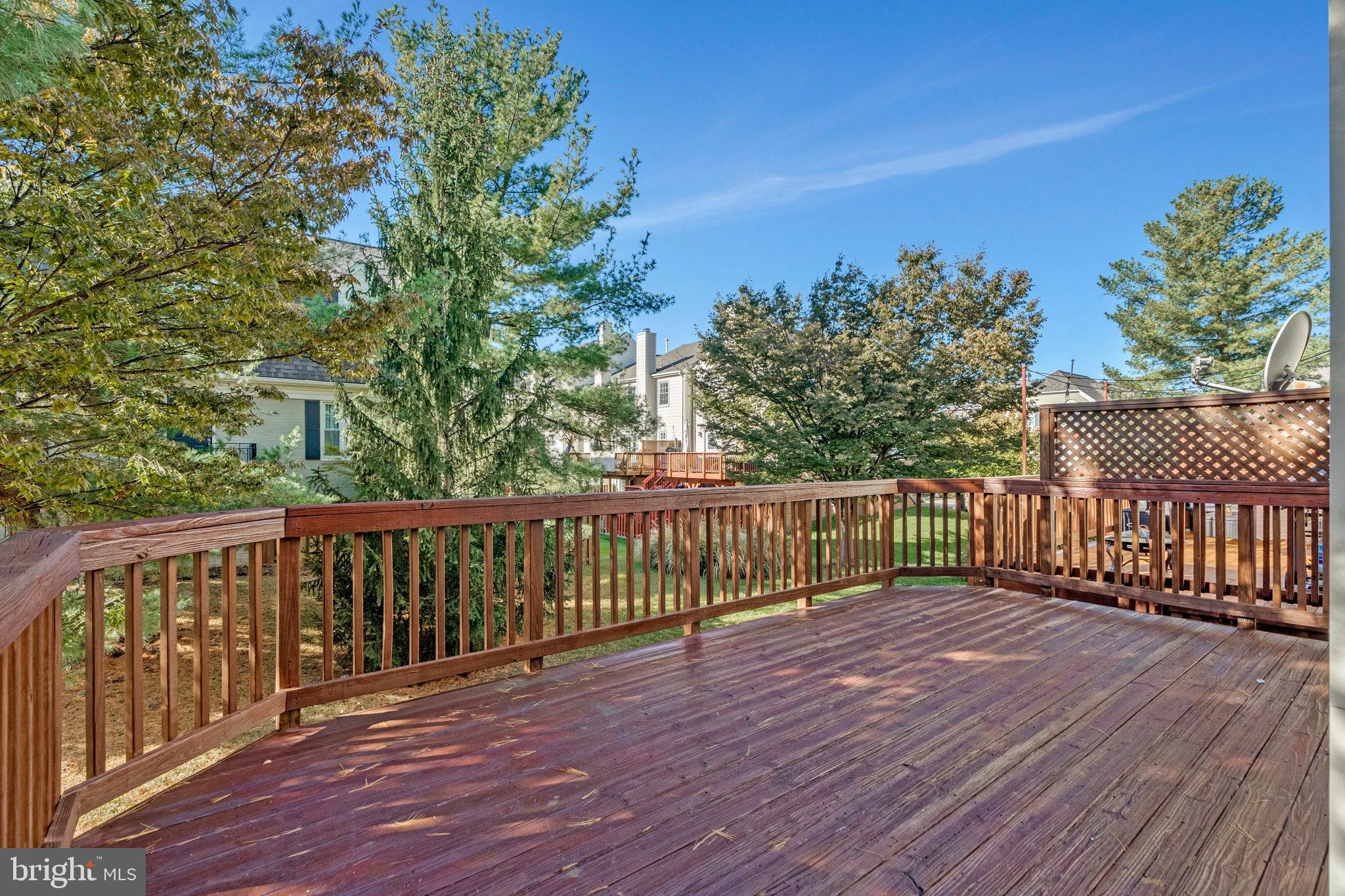 2043 Pieris Court Vienna, VA 22182 - Photo 34 of 43 a balcony with wooden floor and fence