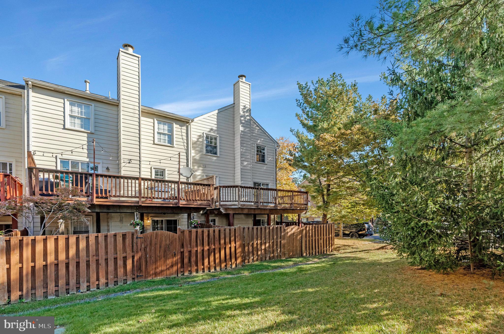 2043 Pieris Court Vienna, VA 22182 - Photo 39 of 43 a front view of a house with a garden and yard