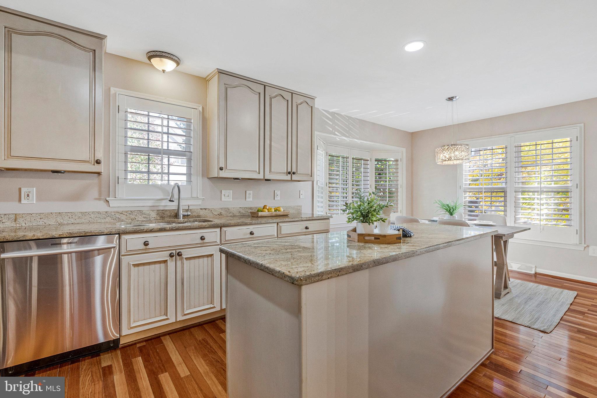 2043 Pieris Court Vienna, VA 22182 - Photo 7 of 43 a kitchen with granite countertop cabinets sink and window