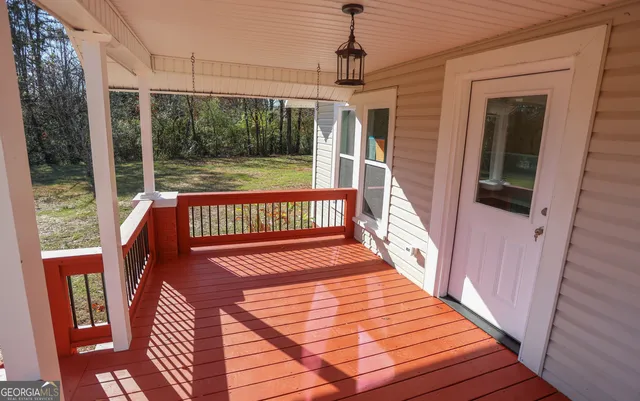 a view of a balcony with wooden floor