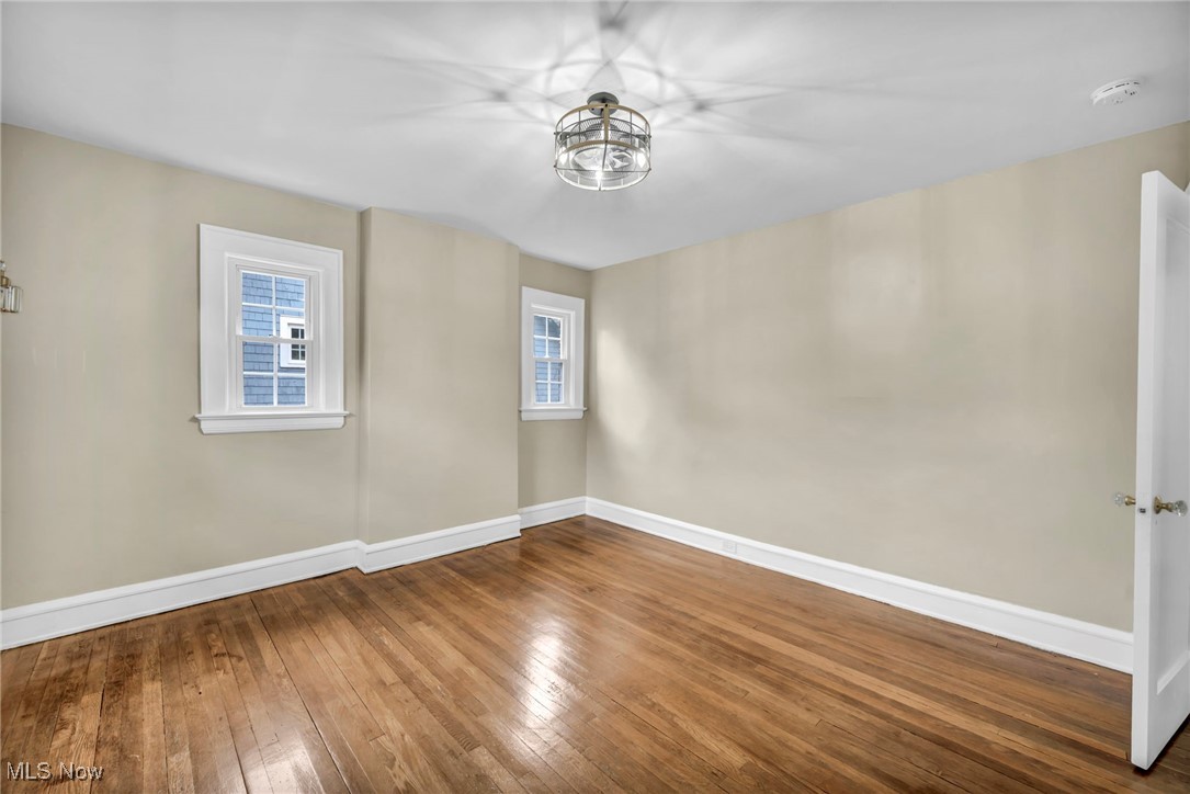 2980 East Overlook Road Cleveland, OH 44118 - Photo 31 of 49 Empty room featuring hardwood / wood-style flooring and plenty of natural light