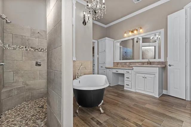 a room with a table chairs and a chandelier