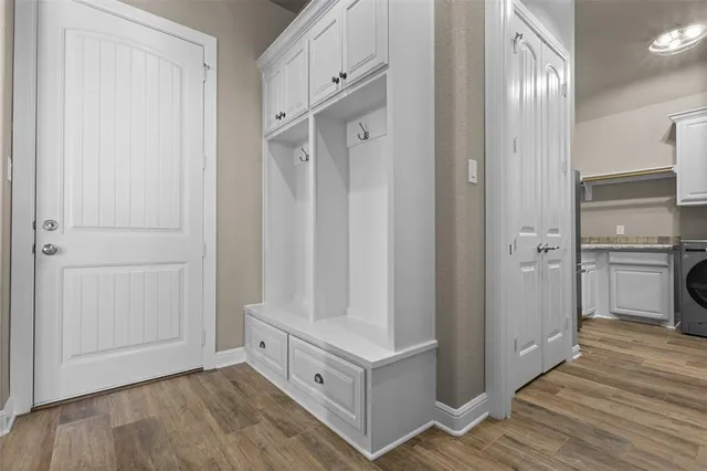 a bathroom with a toilet a sink and a mirror