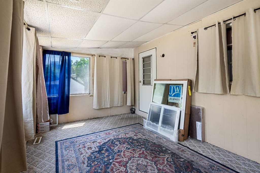 8 F Street Merrimac, MA 01860 - Photo 17 of 20 a view of a hallway with furniture and a rug