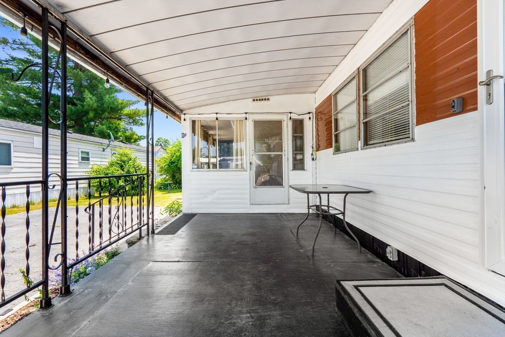 8 F Street Merrimac, MA 01860 - Photo 3 of 20 a view of a patio with table and chairs and wooden floor