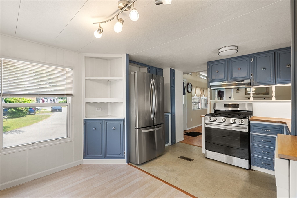 8 F Street Merrimac, MA 01860 - Photo 4 of 20 a kitchen with granite countertop a refrigerator stove and oven