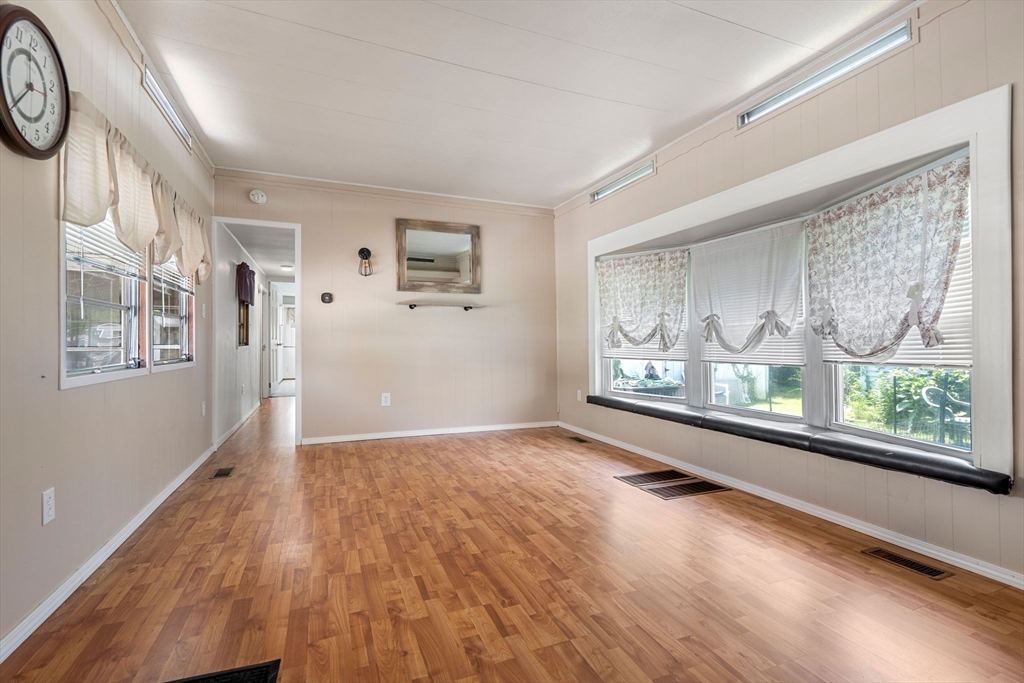 8 F Street Merrimac, MA 01860 - Photo 9 of 20 a view of a big room with wooden floor and windows