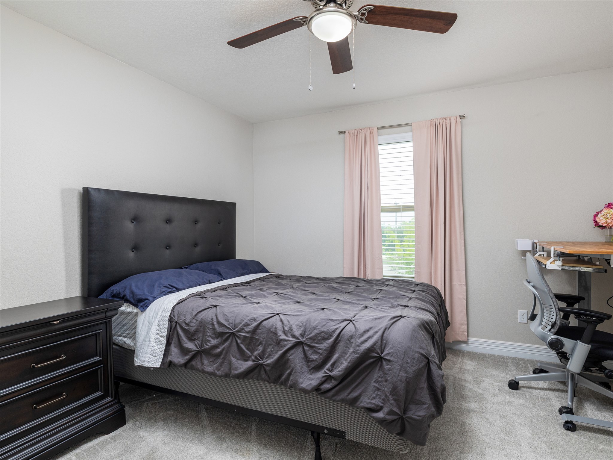 717 Blue Agave Lane Georgetown, TX 78626 - Photo 22 of 28 a bedroom with a bed and a chair