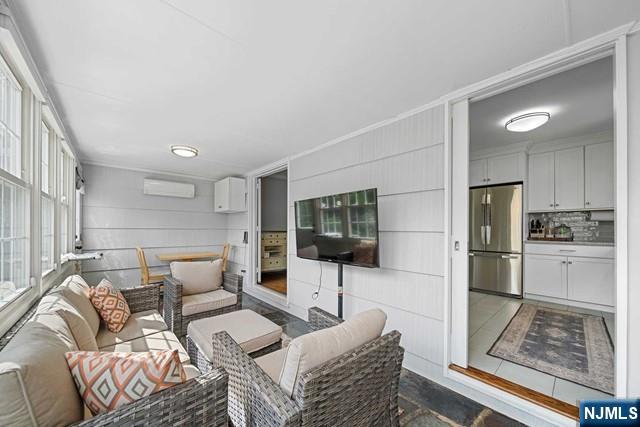 364 Rutland Avenue Teaneck, NJ 07666 - Photo 17 of 29 a living room with furniture and a flat screen tv