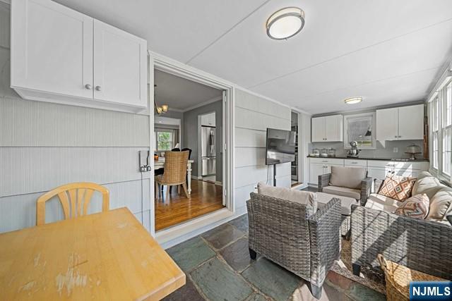 364 Rutland Avenue Teaneck, NJ 07666 - Photo 18 of 29 a living room with furniture and a dining table