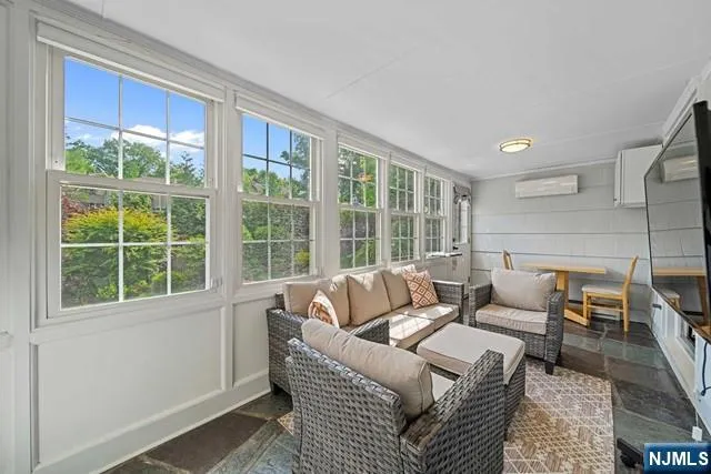 a living room with furniture and a window