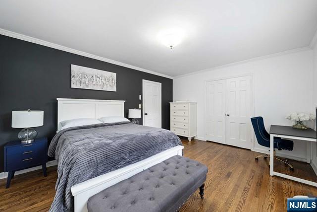 364 Rutland Avenue Teaneck, NJ 07666 - Photo 20 of 29 a bedroom with a bed and wooden floor