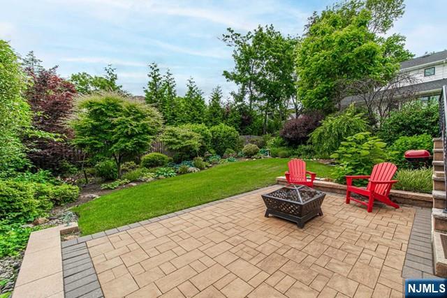 364 Rutland Avenue Teaneck, NJ 07666 - Photo 2 of 29 a view of a backyard with sitting area